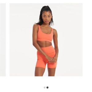 Vuori women’s daily sports bra in grapefruit